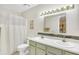 Well-lit bathroom with double sinks and a shower-tub combination at 6634 Cinnamon Fern Ln., Myrtle Beach, SC 29588