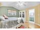 Bright bedroom features with built-in storage and an attached bathroom at 6634 Cinnamon Fern Ln., Myrtle Beach, SC 29588