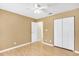 Clean bedroom with light-colored walls, a closet, and wood-look flooring at 6634 Cinnamon Fern Ln., Myrtle Beach, SC 29588