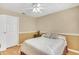 Cozy bedroom with tan walls, crown moulding, and comfortable-looking bed at 6634 Cinnamon Fern Ln., Myrtle Beach, SC 29588