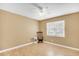 Simple bedroom featuring light walls, a bright window, and wood-look flooring at 6634 Cinnamon Fern Ln., Myrtle Beach, SC 29588