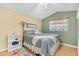 Cozy bedroom with natural light and comfortable furnishings at 6634 Cinnamon Fern Ln., Myrtle Beach, SC 29588