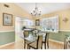 Dining room with ample sunlight, views to the kitchen, and modern finishes at 6634 Cinnamon Fern Ln., Myrtle Beach, SC 29588