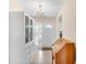 Bright entryway featuring custom built-in storage and tiled floor and a view to the front door at 6634 Cinnamon Fern Ln., Myrtle Beach, SC 29588