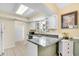 Bright kitchen with a breakfast bar, featuring natural light and modern appliances at 6634 Cinnamon Fern Ln., Myrtle Beach, SC 29588