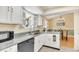 Cozy kitchen with ample cabinet space, modern appliances, and views to the dining room at 6634 Cinnamon Fern Ln., Myrtle Beach, SC 29588
