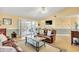 Bright living room with vaulted ceiling, and access to outdoor patio at 6634 Cinnamon Fern Ln., Myrtle Beach, SC 29588