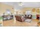 Open-concept living room with light wood floors and comfortable seating at 6634 Cinnamon Fern Ln., Myrtle Beach, SC 29588