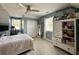 Upstairs bedroom with light-blue walls and a window, complemented by stylish décor and ample storage at 6636 Breezewood Blvd., Myrtle Beach, SC 29588