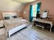 Upstairs bedroom with pink walls, white trim and furniture, plus a turquoise curtain at 6636 Breezewood Blvd., Myrtle Beach, SC 29588