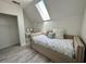 Neutral bedroom with daybed, skylight and a view of the vanity area at 6636 Breezewood Blvd., Myrtle Beach, SC 29588