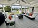 Relaxing covered patio with comfortable seating, stylish décor, and serene lake views at 6636 Breezewood Blvd., Myrtle Beach, SC 29588
