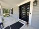 Stylish front door with glass inserts, showcasing modern design and curb appeal at 6636 Breezewood Blvd., Myrtle Beach, SC 29588