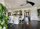 Open kitchen with a large center island, stylish bar stools, and access to the front door at 6636 Breezewood Blvd., Myrtle Beach, SC 29588