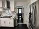 Modern kitchen features stainless steel appliances, white cabinets and a white marble backsplash at 6636 Breezewood Blvd., Myrtle Beach, SC 29588