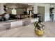Bright, modern kitchen featuring white cabinets, marble countertops, and stainless steel appliances at 6636 Breezewood Blvd., Myrtle Beach, SC 29588
