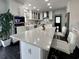 Modern kitchen featuring white cabinets, marble countertops, and stainless steel appliances at 6636 Breezewood Blvd., Myrtle Beach, SC 29588