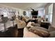 Spacious living room featuring a stone fireplace, hardwood floors, and plenty of comfortable seating at 6636 Breezewood Blvd., Myrtle Beach, SC 29588