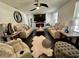 Bright living room boasts a cozy fireplace, plush furniture, and stylish decor for relaxing at 6636 Breezewood Blvd., Myrtle Beach, SC 29588
