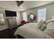 Comfortable bedroom offers neutral colors, lots of light, dresser and a decorative pink chair at 6636 Breezewood Blvd., Myrtle Beach, SC 29588