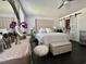 Bright main bedroom features a large bed, and barn door access to the bathroom at 6636 Breezewood Blvd., Myrtle Beach, SC 29588
