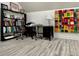 Inviting office space with desk, chairs, bookshelf, and vibrant modern art at 6636 Breezewood Blvd., Myrtle Beach, SC 29588