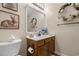 Charming bathroom with a wooden vanity, decorative mirrors, and delicate floral accents at 813 Silvercrest Dr., Myrtle Beach, SC 29579