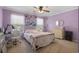 Bedroom featuring a comfortable bed, a desk, and natural light from two windows at 813 Silvercrest Dr., Myrtle Beach, SC 29579