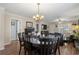 Open dining area with wood floors, chandelier, and views of the living room at 813 Silvercrest Dr., Myrtle Beach, SC 29579