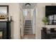 Hallway with staircase, fireplace and a neutral paint palette at 813 Silvercrest Dr., Myrtle Beach, SC 29579