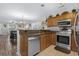 Open concept kitchen featuring stainless steel appliances and a breakfast bar area at 813 Silvercrest Dr., Myrtle Beach, SC 29579