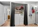 Laundry closet featuring a stacked washer and dryer unit at 813 Silvercrest Dr., Myrtle Beach, SC 29579