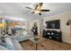 Comfortable living room with a fireplace, TV, and view into the dining area at 813 Silvercrest Dr., Myrtle Beach, SC 29579