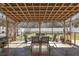 Cozy screened porch featuring outdoor dining furniture and decorative lighting at 813 Silvercrest Dr., Myrtle Beach, SC 29579