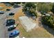 An aerial shot reveals a sandy volleyball court beside the parking lot and green trees at 813 Silvercrest Dr., Myrtle Beach, SC 29579