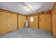 Unfinished basement with a hot water heater, exposed wooden framing, and concrete flooring at 919 Salt Pl., Murrells Inlet, SC 29576