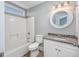 Simple, functional bathroom with new white fixtures and granite counter provides a comfortable, clean space at 919 Salt Pl., Murrells Inlet, SC 29576