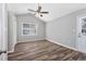 Clean, simple bedroom with vaulted ceiling, a ceiling fan and plenty of natural light provides comfort at 919 Salt Pl., Murrells Inlet, SC 29576