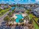 Aerial view of the community pool, with plenty of lounge chairs and clear blue water at 919 Salt Pl., Murrells Inlet, SC 29576