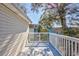 Wooden deck with white railing and a view of the neighborhood at 919 Salt Pl., Murrells Inlet, SC 29576