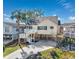 Inviting coastal home featuring elevated construction, a palm tree, and a spacious driveway at 919 Salt Pl., Murrells Inlet, SC 29576