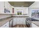 Well-lit kitchen with modern appliances, granite countertops, and white cabinets provide a clean and stylish design at 919 Salt Pl., Murrells Inlet, SC 29576