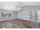 Spacious living room featuring wood floors, vaulted ceilings, and sliding door access to the outdoors at 919 Salt Pl., Murrells Inlet, SC 29576