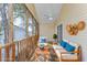 Cozy screened porch with comfortable seating, ceiling fan, and stylish decorations at 919 Salt Pl., Murrells Inlet, SC 29576