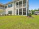 Backyard showing an exterior elevation of condo with a beautiful lawn at 933 Jackline Place # 101, Murrells Inlet, SC 29576