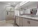 Elegant bathroom with a glass-enclosed shower, double vanity, and modern fixtures at 933 Jackline Place # 101, Murrells Inlet, SC 29576