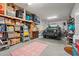 Spacious garage filled with storage boxes and shelves, showcasing organizational potential at 933 Jackline Place # 101, Murrells Inlet, SC 29576