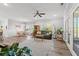Open-concept living area with ample natural light, wood floors, and contemporary furnishings for comfortable living at 933 Jackline Place # 101, Murrells Inlet, SC 29576