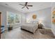 Serene main bedroom showcasing neutral tones, stylish lighting, and hardwood floors for a relaxing retreat at 933 Jackline Place # 101, Murrells Inlet, SC 29576