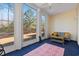 Inviting sunroom featuring large windows, cozy seating, and a colorful rug at 933 Jackline Place # 101, Murrells Inlet, SC 29576